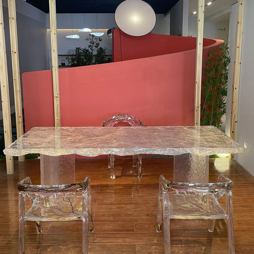 A sleek, all - resin dining table with a textured surface.