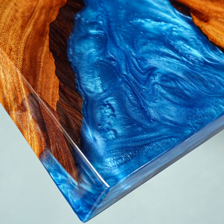 Blue epoxy and walnut wood river table for beach house decor