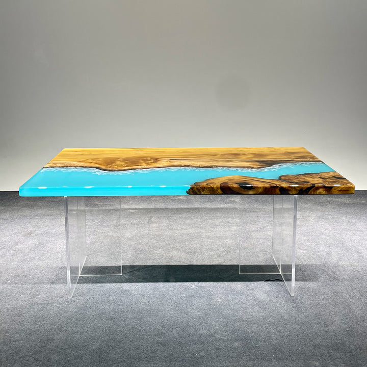Epoxy resin river table with natural wood grain and coastal design