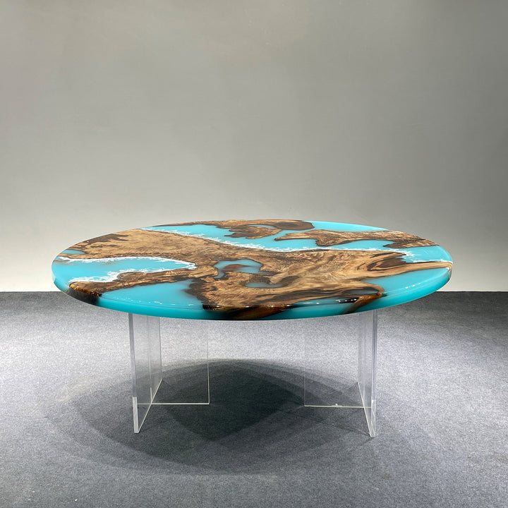 Round epoxy river table – golden camphor wood with glossy blue resin