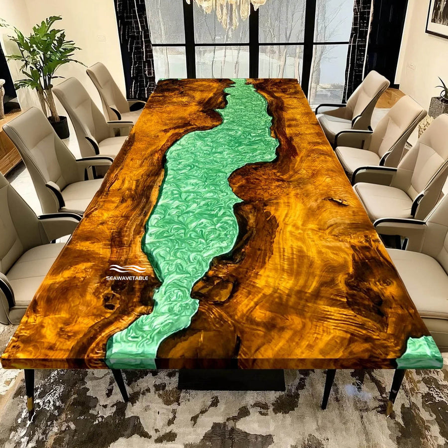 Golden camphor wood table with flowing green epoxy river design