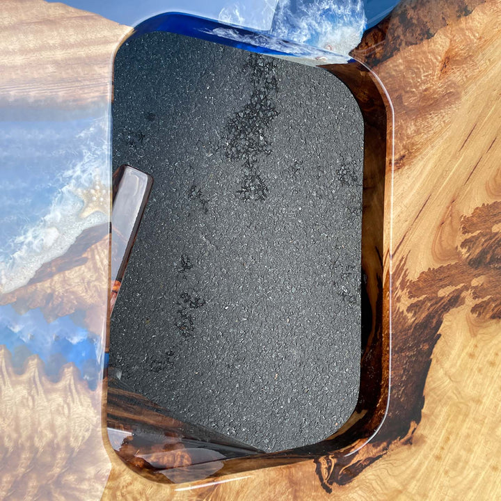 Artisan epoxy table showing ocean wave and beach-inspired details