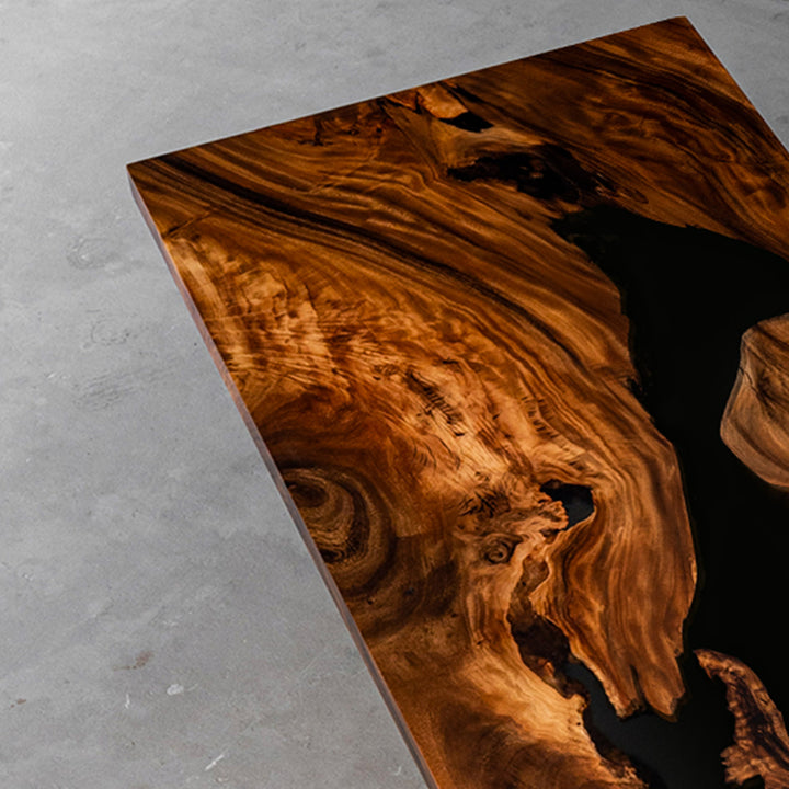 Modern epoxy river office table highlighting rich walnut wood grain