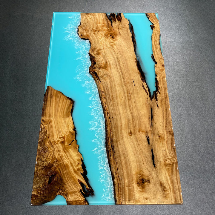 Custom epoxy resin river table with live edge wood slab