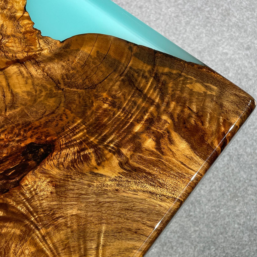 Modern wood coffee table with blue ocean epoxy and camphor wood