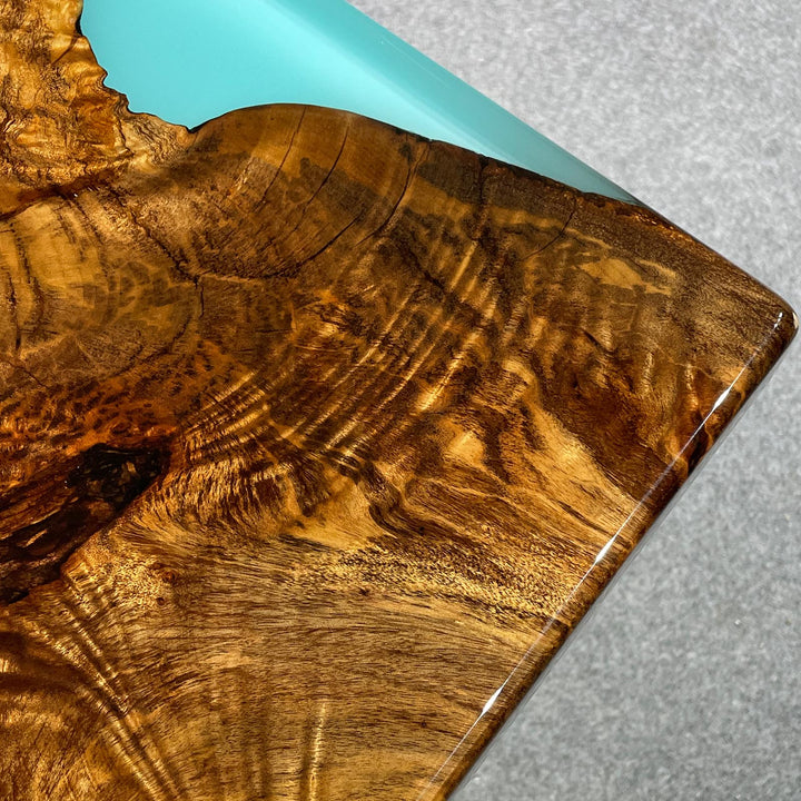 Modern wood coffee table with blue ocean epoxy and camphor wood