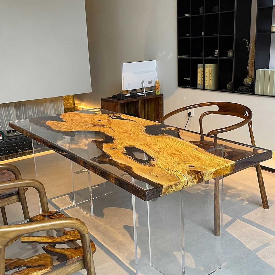 Olive wood and resin table with matching wooden chairs, set in a modern interior