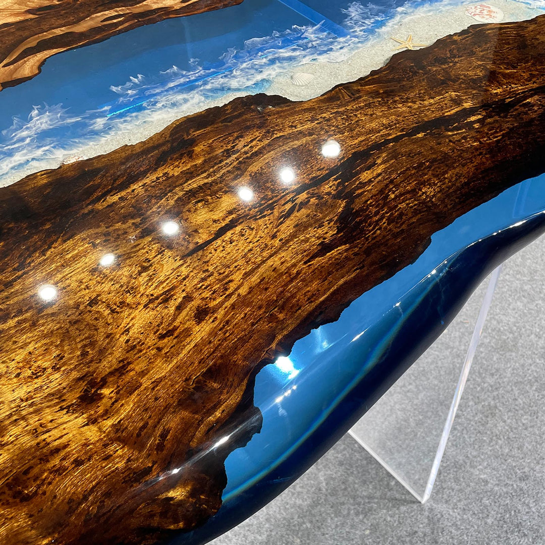 Resin river dining table with custom epoxy color and solid wood design