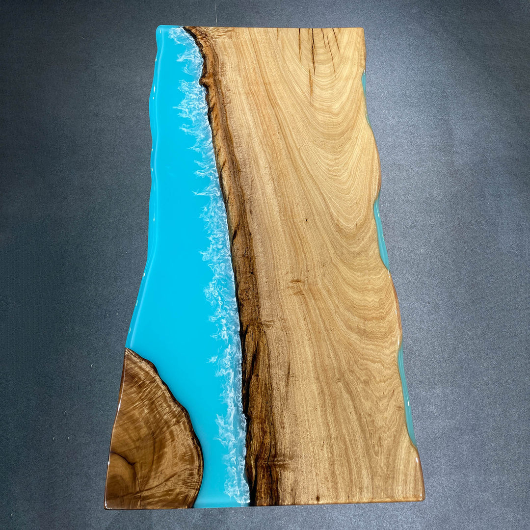 Seawavetable-Epoxy river table featuring natural wood and ocean blue resin