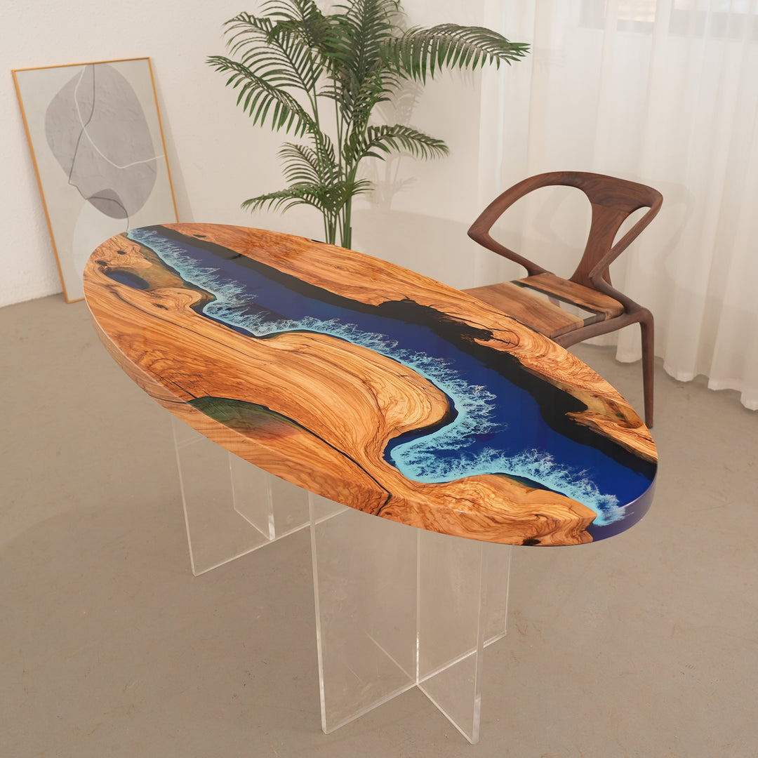 Custom epoxy river table featuring swirling blue resin and rich olive grain