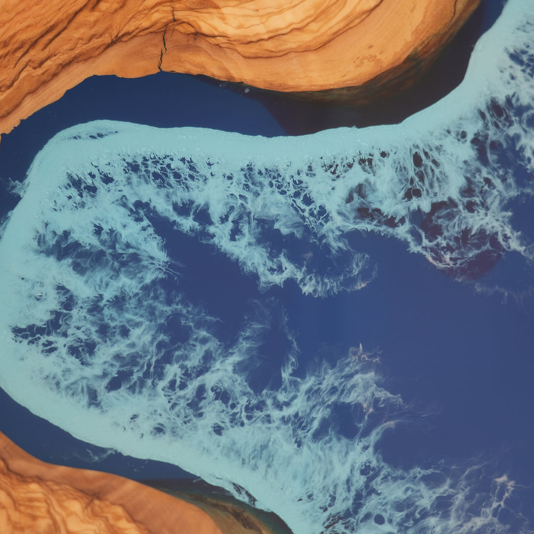 Olive wood and deep blue epoxy coffee table with coastal wave