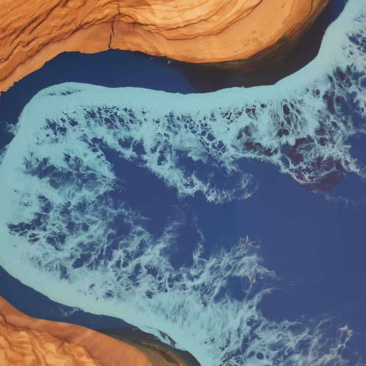 Olive wood and deep blue epoxy coffee table with coastal wave
