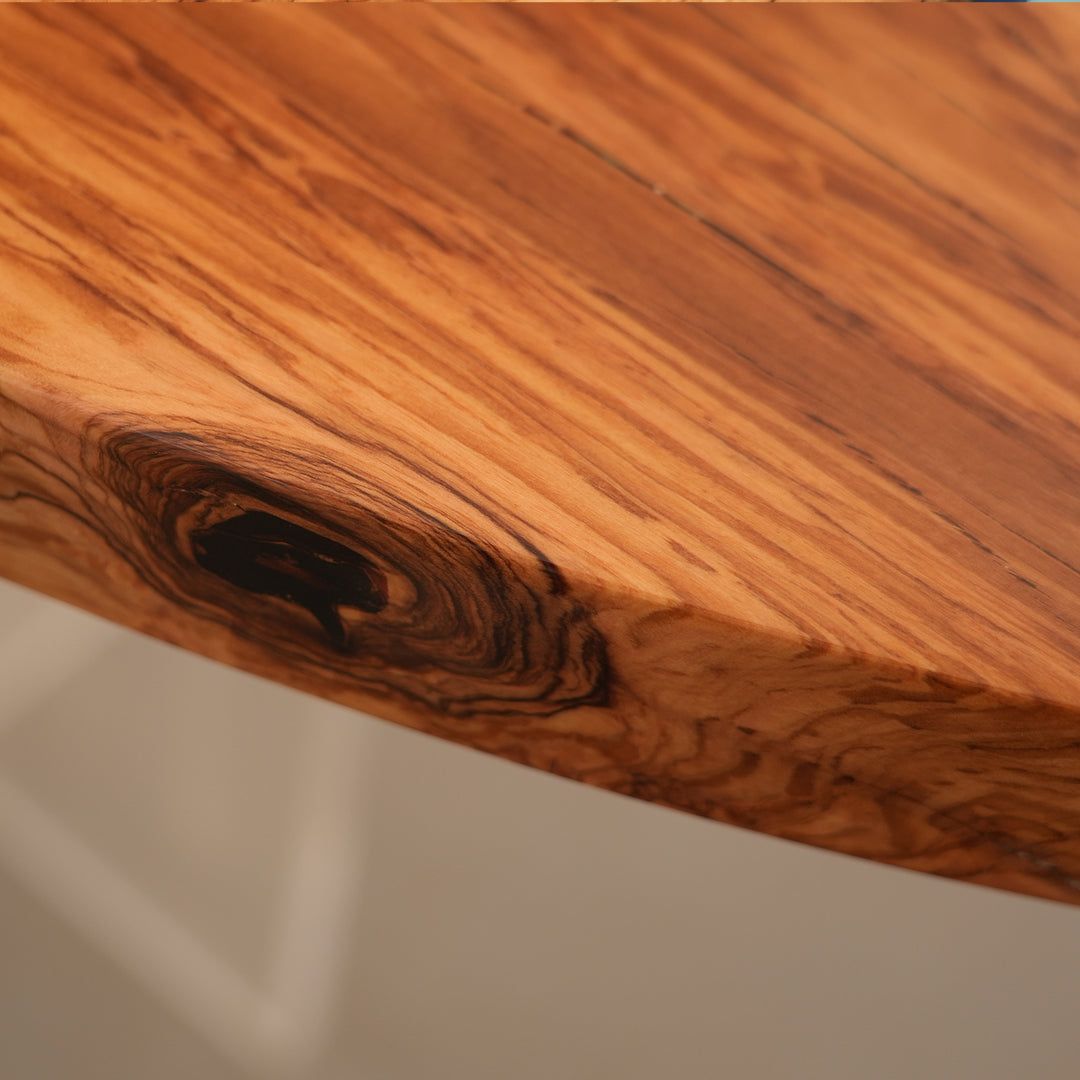 High-end epoxy ocean table with bold resin river and olive wood texture