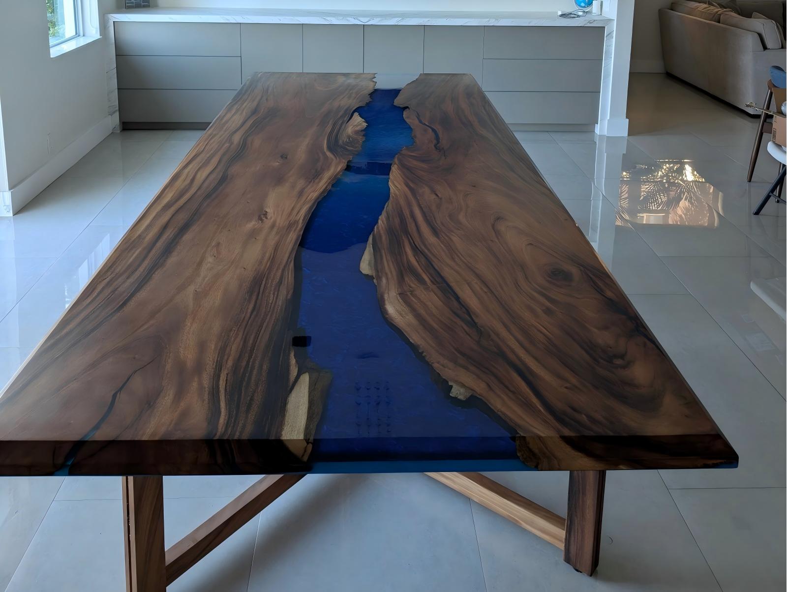 Customer dining room featuring the matte walnut banquet table with deep ocean blue epoxy river design.