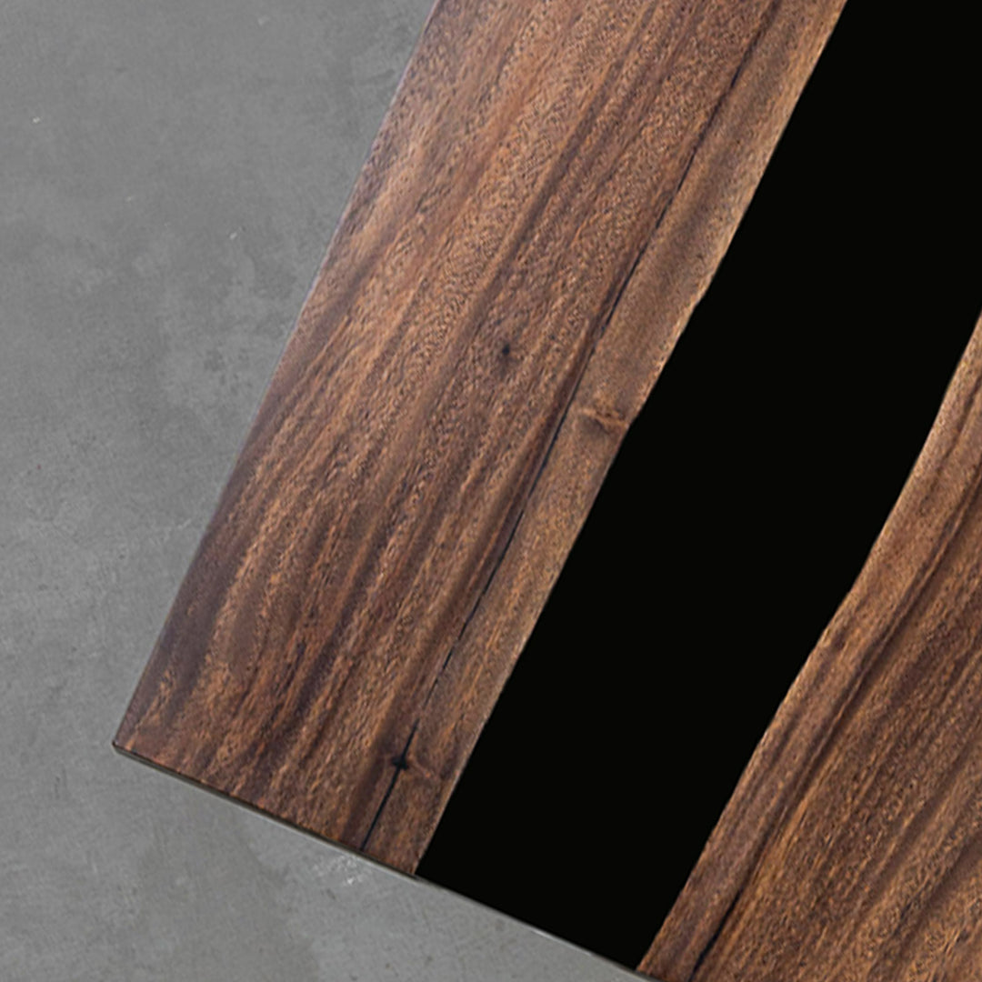 Matte black epoxy surface of CRT-175 walnut table under natural light