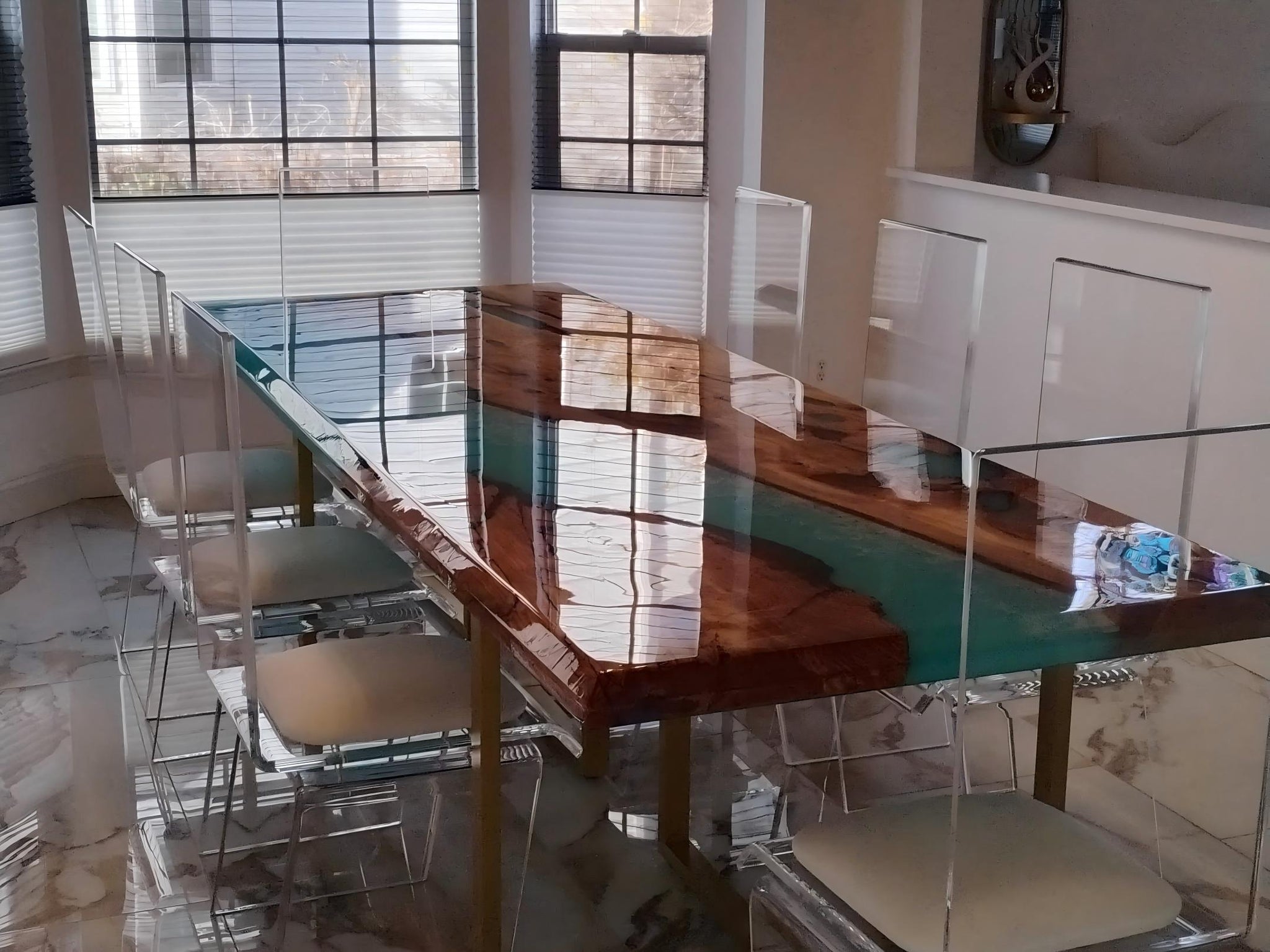 Custom blue resin river table in a modern coastal interior