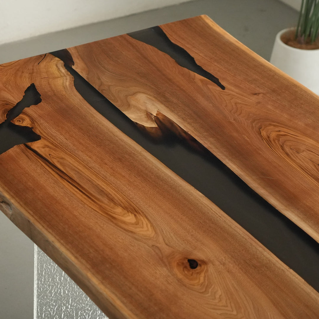 Handcrafted live edge table made from walnut wood and black resin for boardrooms