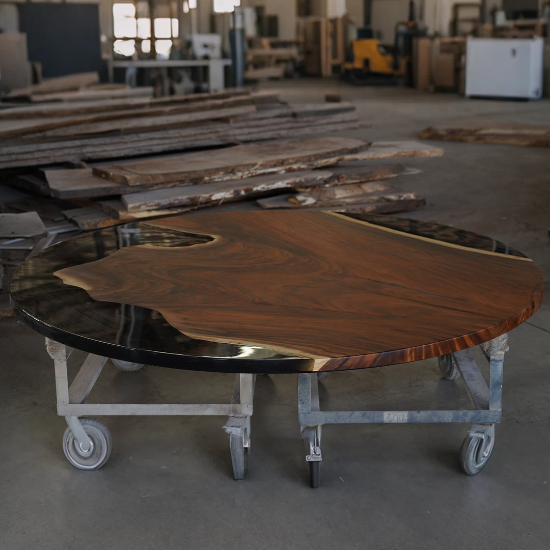 Beautiful round black epoxy walnut dining table bringing modern elegance to Miami homes