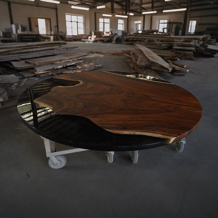 Live edge black walnut round epoxy dining table crafted for timeless Boston interiors