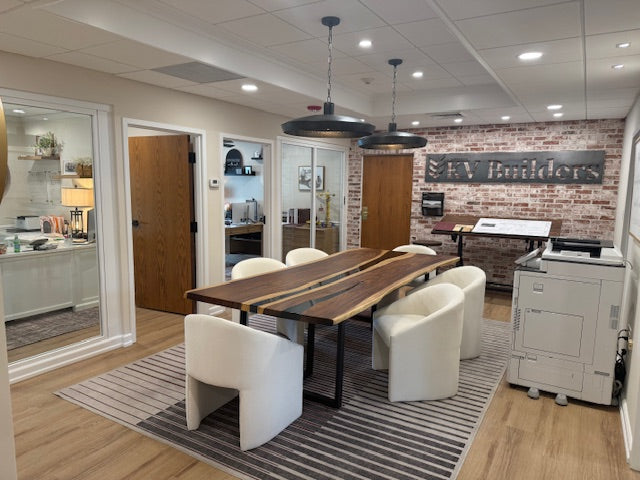 Modern studio meeting table featuring Black Walnut and sleek black epoxy design