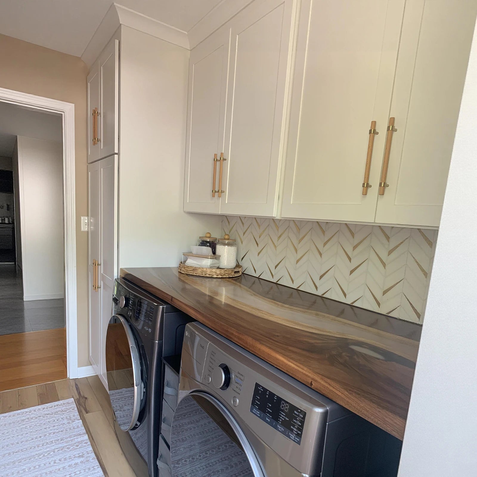 Handcrafted walnut resin shelf with gold accented Lunar Silk resin serving as laundry room storage surface