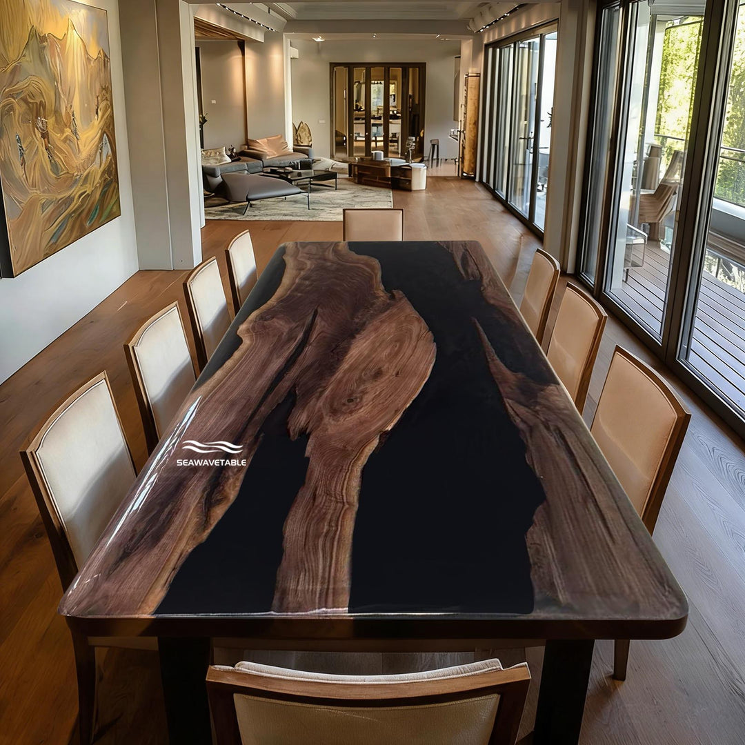 Epoxy resin river dining table with natural live edge wood slabs and glossy black resin centerpiece, modern handcrafted statement table for contemporary interiors
