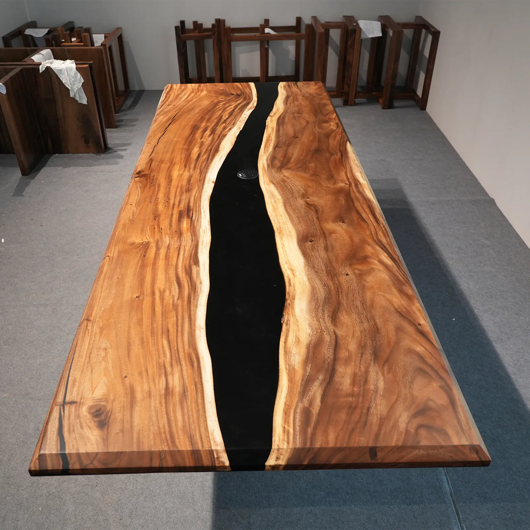 Top view of 108-inch Walnut and black epoxy dining table by SeawaveTable