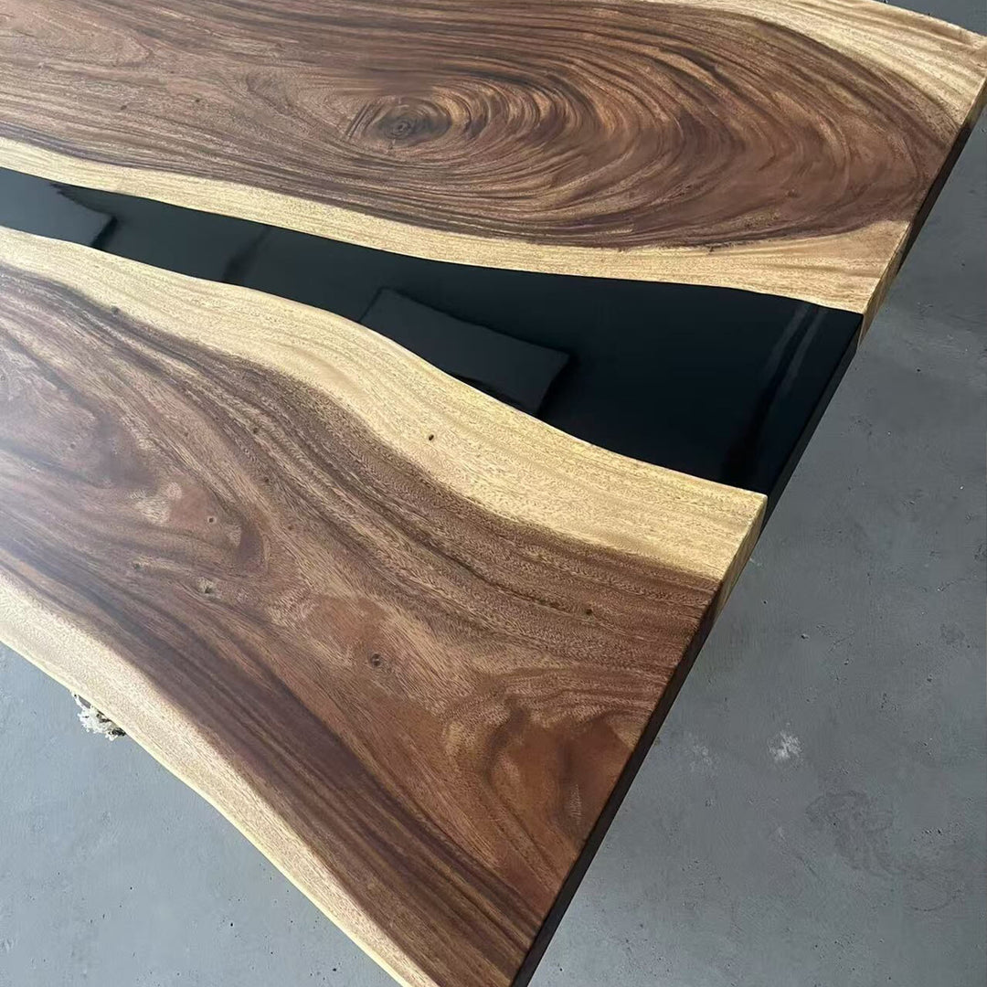 Wooden surface with black base on a gray floor