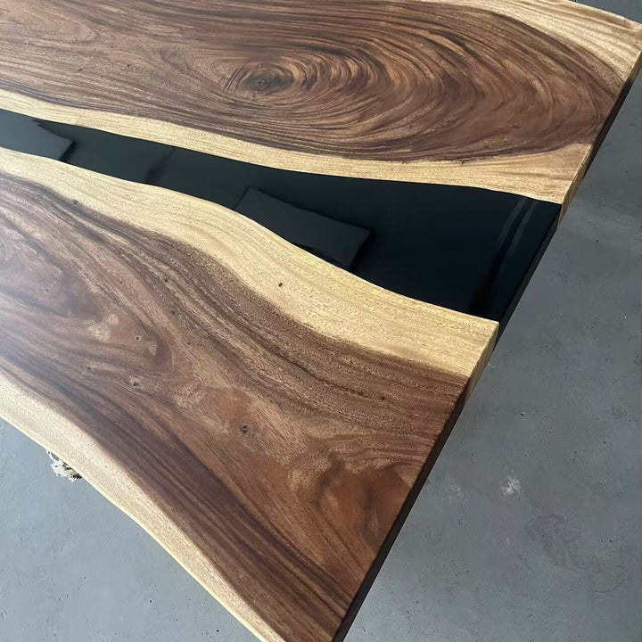 Wooden surface with black base on a gray floor