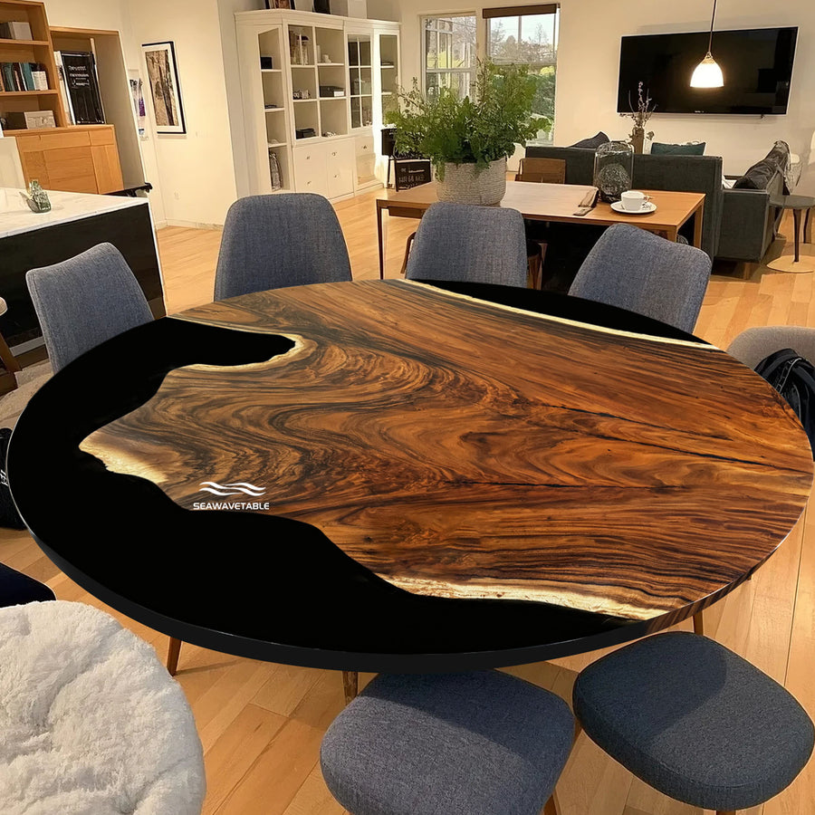 Wooden dining table with black base in a living room setting