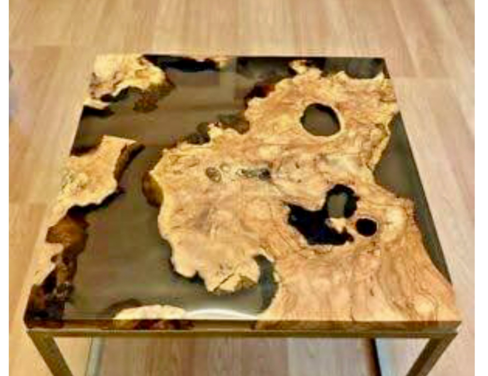 Square coffee table with natural wood design and glass top on a wooden floor.