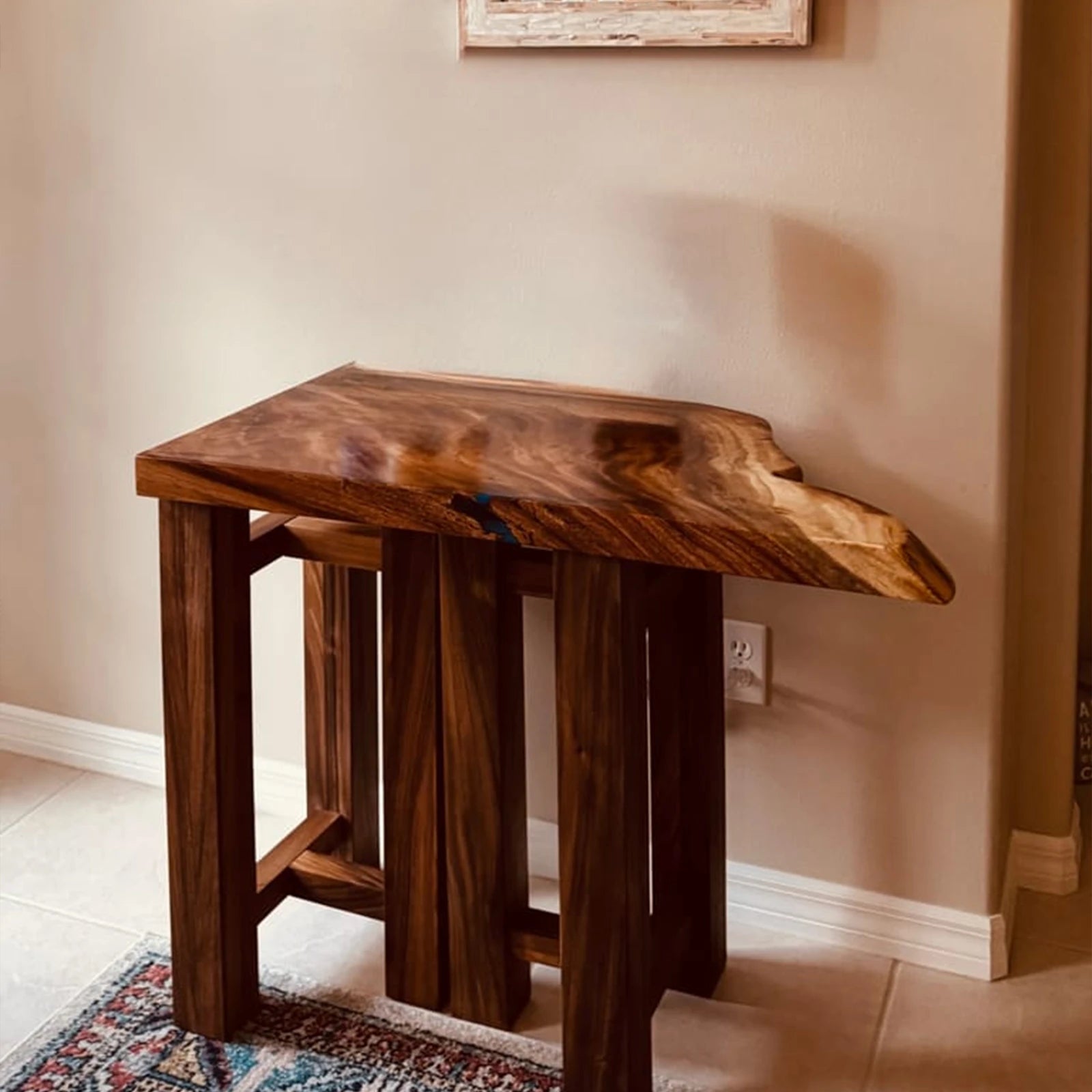 Wooden side table against a beige wall