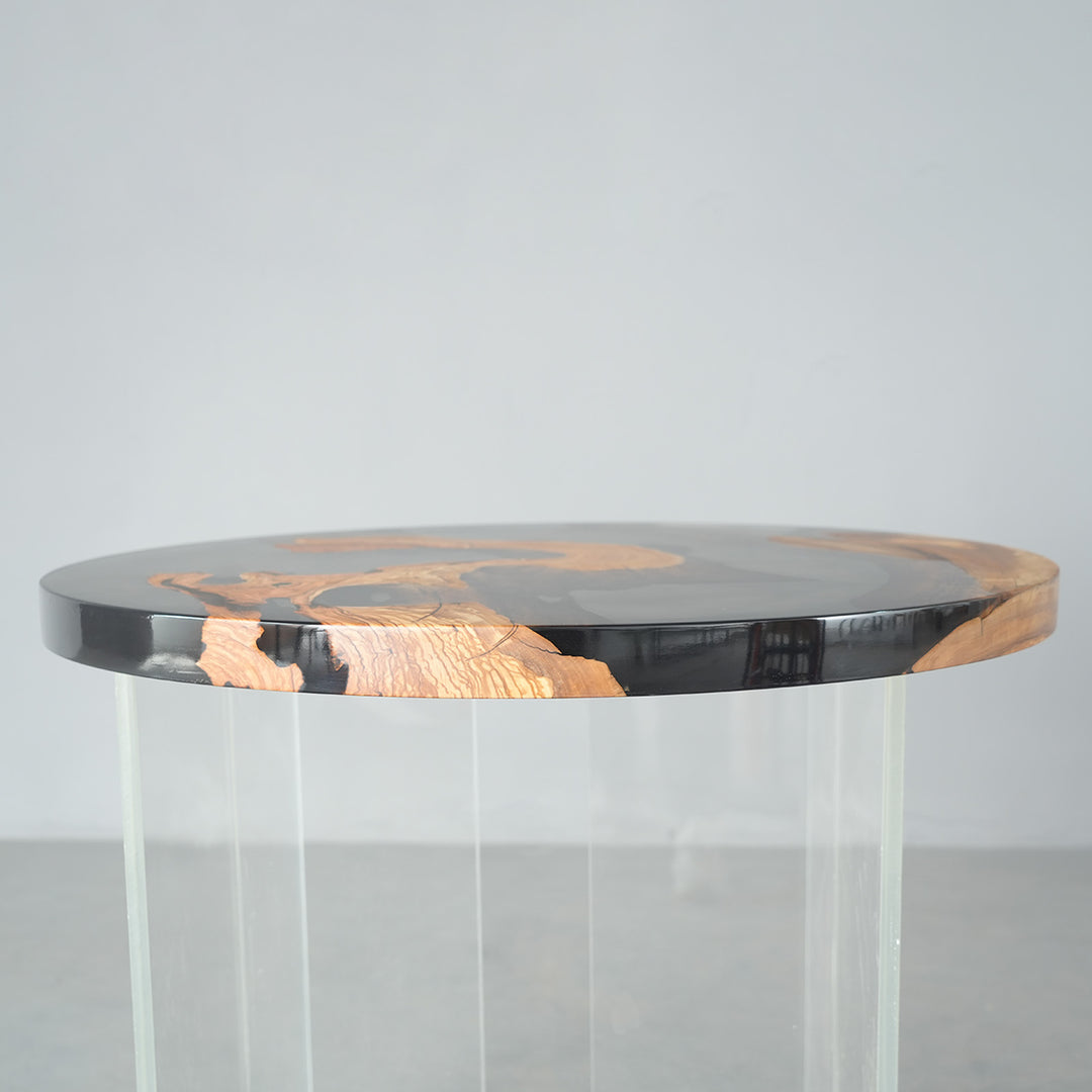 Smoky epoxy round table featuring live edge olive burl wood details