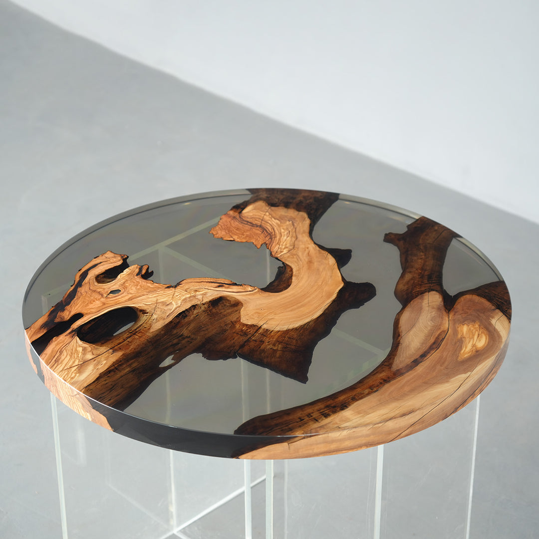 Artistic olive wood resin table with natural grain and polished surface