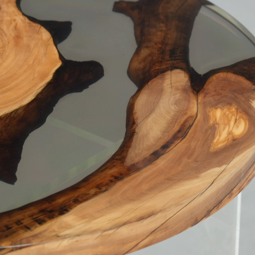 Olive wood and smoky quartz epoxy fusion table in contemporary living room