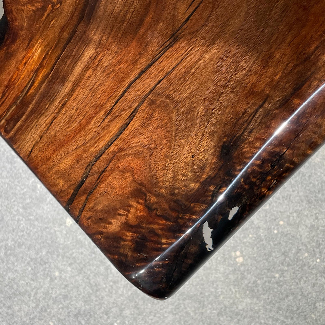 Luxury live edge epoxy river table with polished high-gloss surface