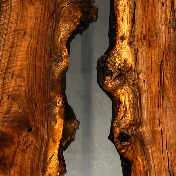 Artistic epoxy river design running between two Walnut slabs