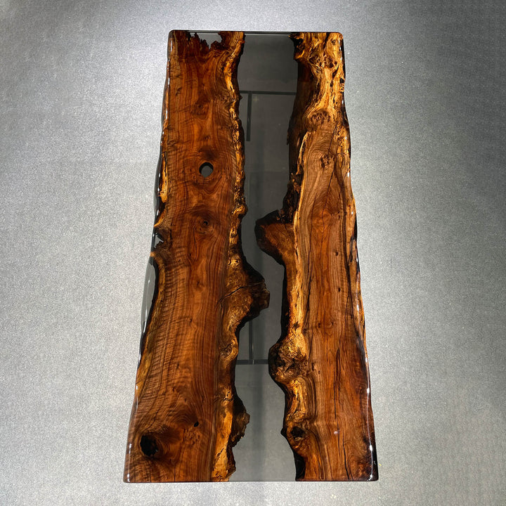 Modern dining table featuring natural live edge Walnut slabs and black resin center
