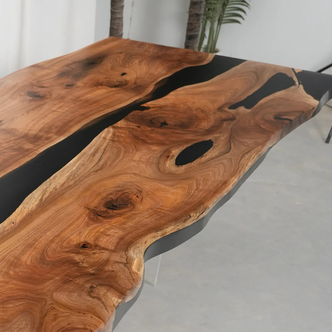 Hand-finished walnut epoxy resin table with a matte surface and contrasting dark river channel.