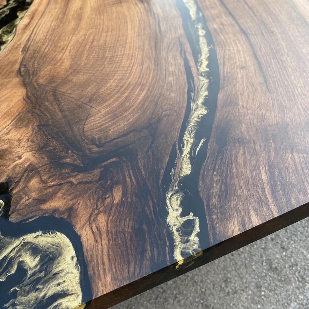 Solid walnut live edge table with black resin river and luxury gold detailing