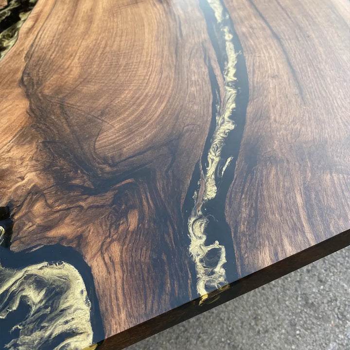 Solid walnut live edge table with black resin river and luxury gold detailing