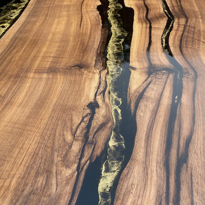 Artisan wood table with flowing epoxy river and gold highlight finish