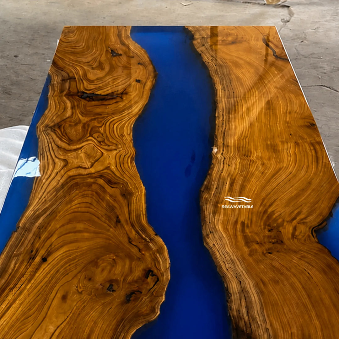 High-end modern river table with natural wood and blue epoxy