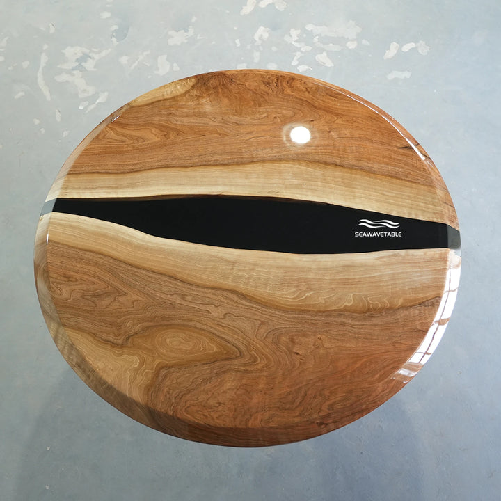 Resin black walnut coffee table display featuring a handcrafted wooden coffee table with a distinctive epoxy table top design - SeaWaveTable