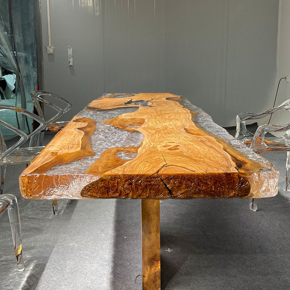 Olive wood and resin table with transparent chairs