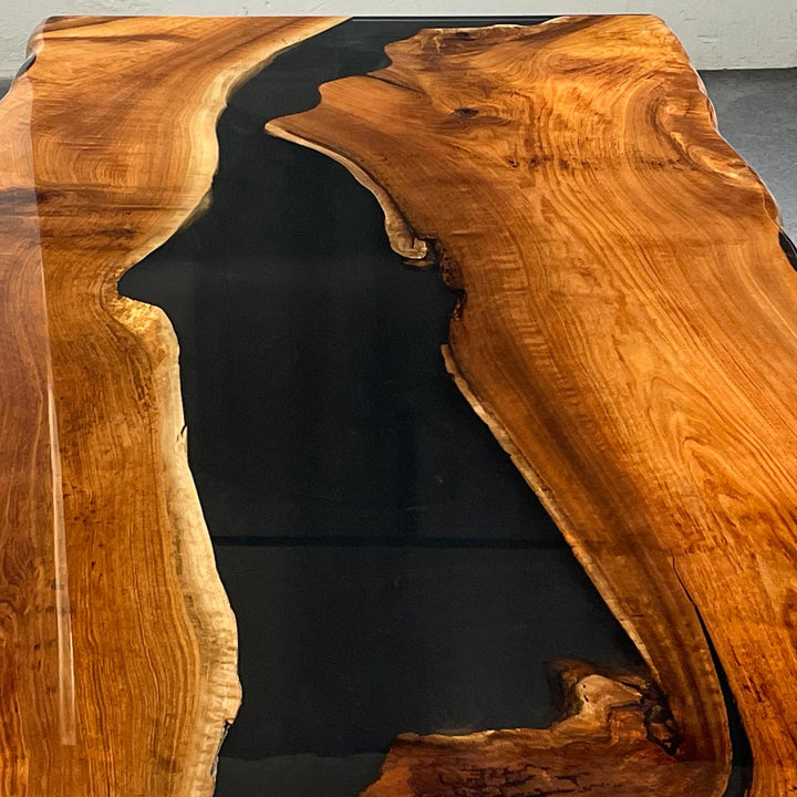 black walnut epoxy table showing natural wood grain and smooth finish
