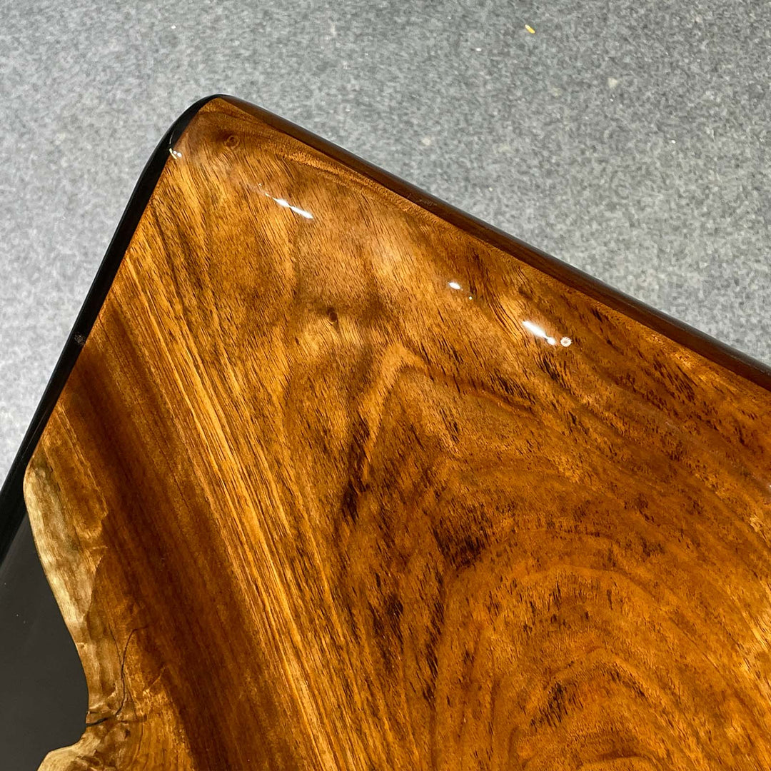 rustic black walnut table with clear epoxy river design
