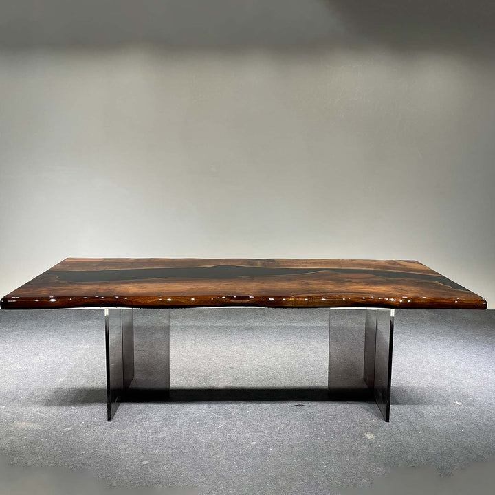 epoxy resin table featuring black walnut slabs and deep black resin