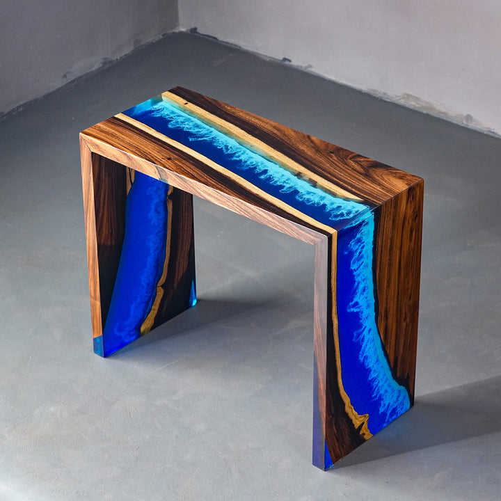 Luxury waterfall edge design on a handcrafted walnut and resin entryway table.
