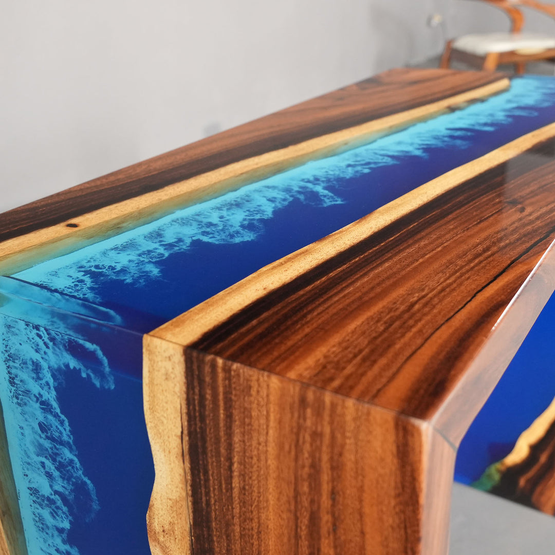 Modern coastal entryway art: walnut wood slab with sea blue epoxy inlay.